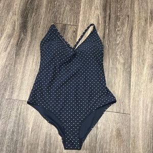 H & M navy blue polka dot convertible one piece. Size 12